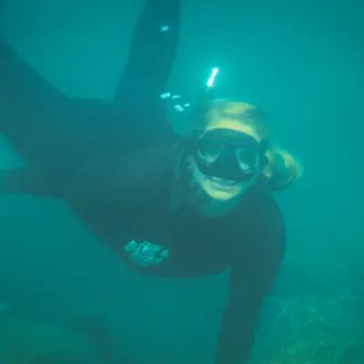 snorkeler underwater on a la jolla snorkel tour